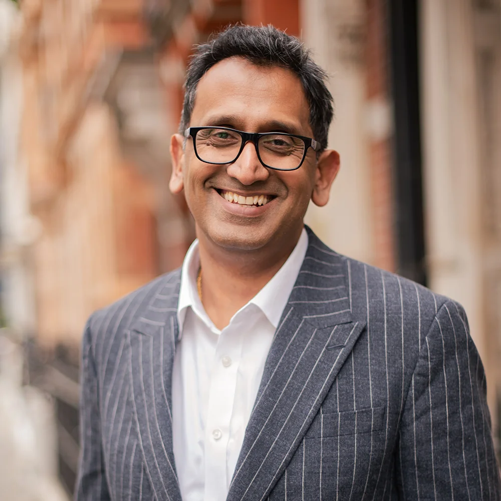 Professor Prasanna Sooriakumaran, Consultant Urologist, portrait in a pinstripe suit