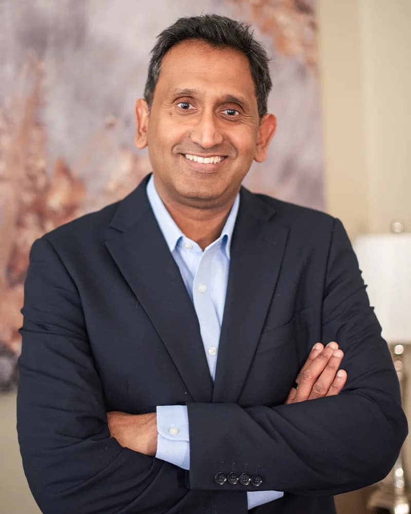 Professor Prasanna Sooriakumaran, robotic prostate surgeon in London, arms folded